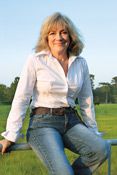 Woman sitting on a fence after a thigh lift