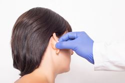 What is earlobe repair?